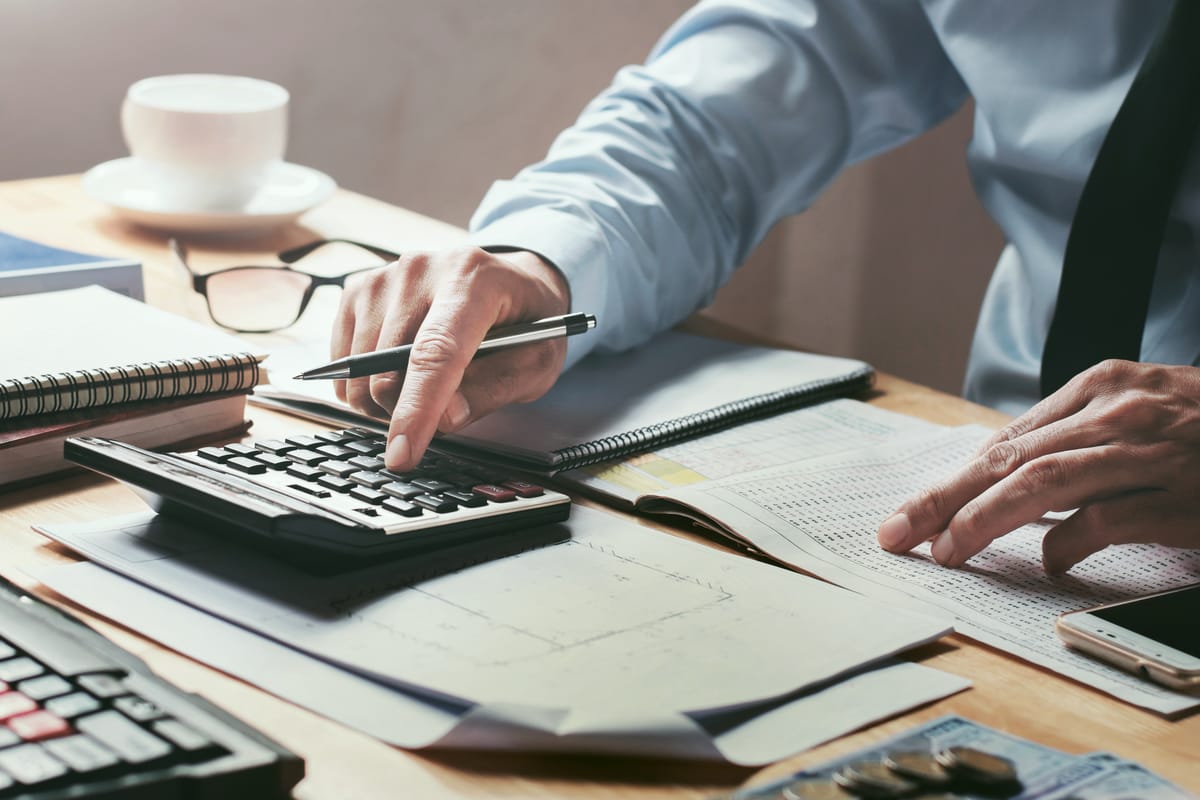 An accountant and a business owner reviewing documents